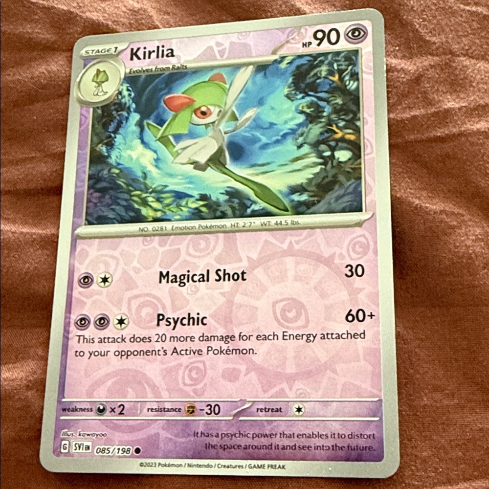 Pokemon Kirlia Card with Green and Pink Accents